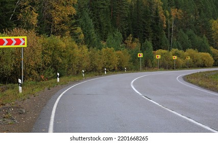 Sharp Turn Road Highway In The Autumn Forest Turn Signs