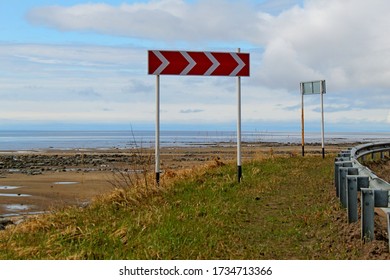 Sharp Turn Sign On The Road