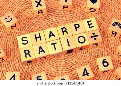 SHARPE RATIO word text from wooden cube block letters. Sharpe ratio measures the performance of investment such as a security or portfolio compared to a risk-free asset, after adjusting for its risk. - Shutterstock ID 2121470189