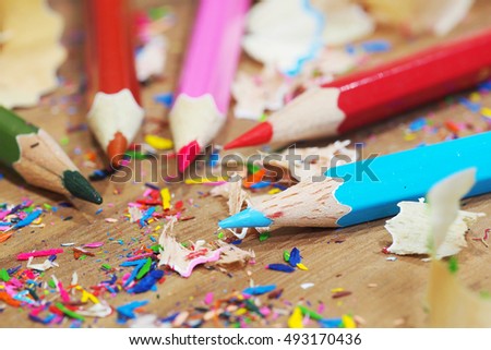 Sharpened color pencil and pencil shavings