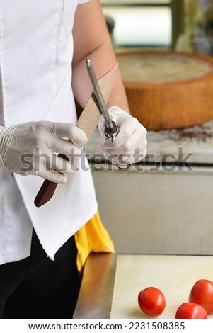 Sharpened knife quickly by the chef.