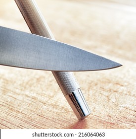 Sharpening Of Knife In A Kitchen. 