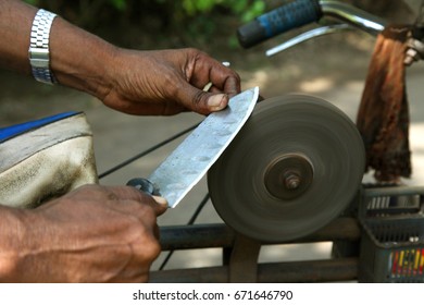 sharpening the knife with whetstone
