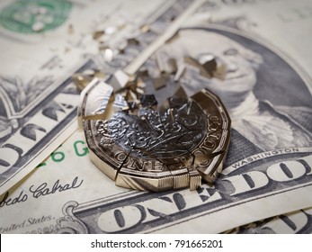 Shattered British Pound Coin On US One Dollar Bills