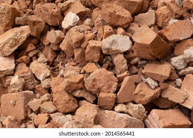 Shattered, Broken  Red Clay Ceramic Bricks,  Construction Waste After Building Demolition. Collection Service 