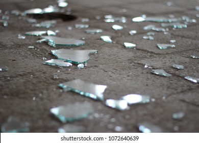 Shattered Glass On A Stone Floor