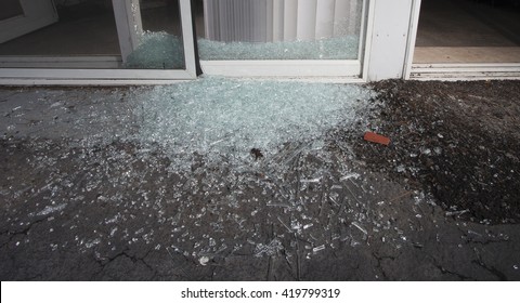 Shattered Glass From A Sliding Door Broken During A Home Invasion