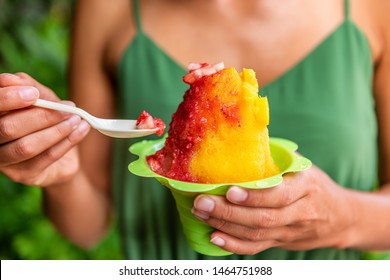 Shave Ice Hawaii Local Food Woman Eating Hawaiian Shaved Ice Cream Treat In Honolulu Waikiki Beach, Hawaii , USA.