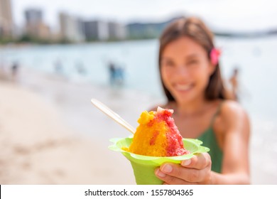 Shave Ice Hawaii Waikiki Beach Woman Eating Hawaiian Shaved Ice Cream Local Food Dessert In Honolulu, Oahu Island Hawaii , USA.