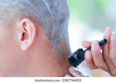 Shave your eyebrows and hair with a razor. Prepare to be ordained as a Buddhist monk. - Powered by Shutterstock