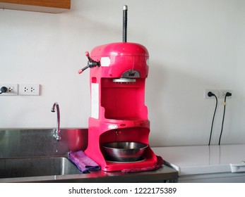 The Shaved Ice Machine In Red Color On Counter With Selective Focus.