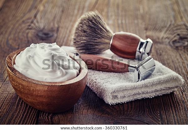 Shaving accessories on\
wooden background
