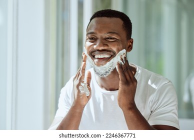 Shaving, cream and black man grooming face for clean look, hygiene care and beauty morning routine in the bathroom. Skincare, happy and African person ready to shave beard and facial hair with foam - Powered by Shutterstock