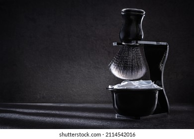 Shaving Foam In Shaving Bowl And Shaving Brash In Stand Kit On Dark Background