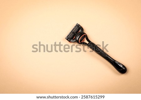 Shaving razor on a light background with free space for text.