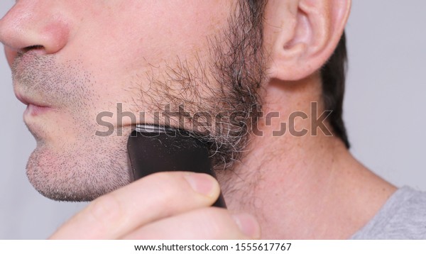 Shaving Sideburns With\
Electric Shaver\
