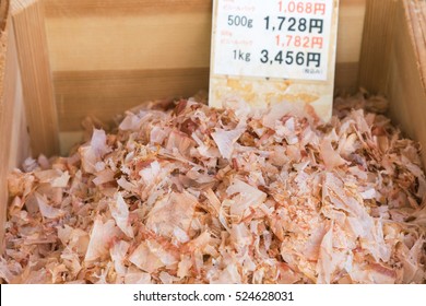 shavings dry tuna fish (bonito or katsuobushi) on the wooden box ready to sale at the Japanese market, bonito or katuobushi is ingredient of dashi (japanese soup stock).