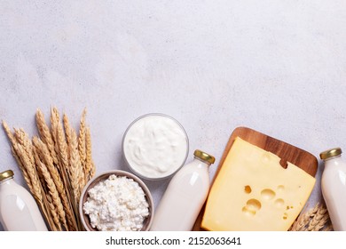 Shavuot flat lay with dairy products and wheat on light gray background, Happy Shavuot web banner. Jewish Shavuot holiday frame with dairy foods, top view - Shutterstock ID 2152063641