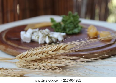 Shavuot Table, With Cheese Platter And Wheat Stalks, Jewish Holiday Of Wheat Harvest