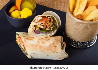 Shawarma Dish In Middle Eastern Cuisine Meat Cut Into Thin Slices, Stacked In A Cone-like Shape, And Roasted Slowly-turning Vertical Rotisserie Or Spit. Made Of Lamb, Pork, Mutton, Turkey, Beef, Veal.