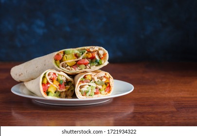 Shawarma Doner Wrap With Chicken Meat Tomatoes Lettuce Cucumber Sauce Potato On Plate Copy Space 