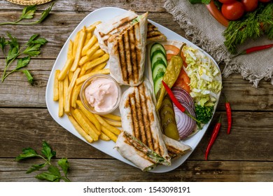 Shawarma On A Plate On Wooden Table