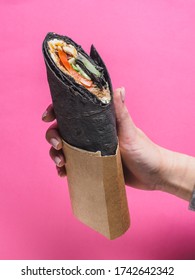 Shawarma Roll With Black Pita On Pink Background. Copy Space.