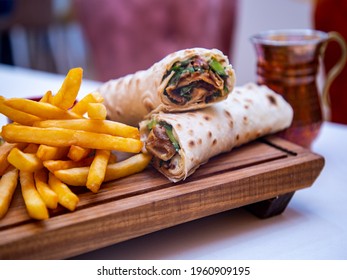 Shawarma Sandwich Fresh Roll Of Lavash.Traditional Middle Eastern Snack Döner Kebab Rolls.