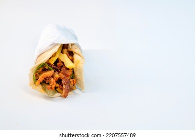 Shawarma Sandwich Fresh Roll Of, Grilled Chicken And Salad Tortilla Wrap With White Sauce Isolated On White Background. 
Shawarma With Grilled Chicken, Cabbage, Carrots, Sauce, Green And Chapati. 