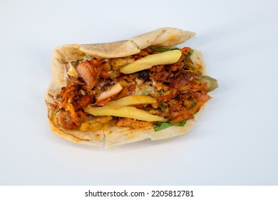 Shawarma Sandwich - Fresh Roll Of Thin Lavash (pita Bread) Filled With Grilled Chicken, Cabbage, Carrots, Sauce, Green. Traditional Eastern Snack. Shawarma With Kabus On Isolated White Background. 

