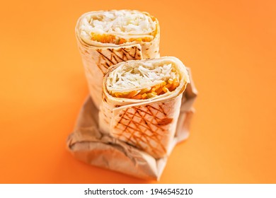 shawarma sandwich roll or burrito meat, vegetables doner kebab sauce tacos weekly meal lunch portion menu food delivery Takeaway snack season trend meal copy space food background rustic. top view