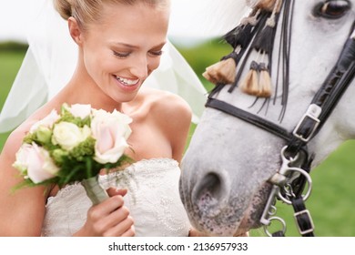 She came into her wedding on horseback. An attractive young bride outside with her horse.