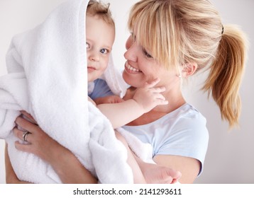 She Loves Her Little Man. Cropped Shot Of A Baby Boy In A Towel Being Held By His Mother.