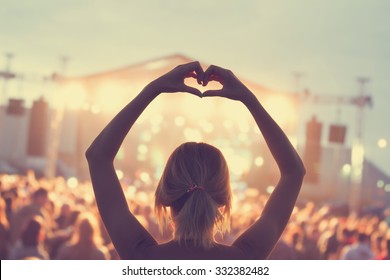 She loves this band! - Shutterstock ID 332382482