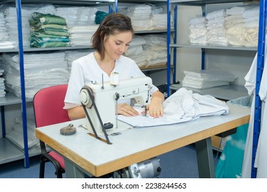 she is sewing the fabric