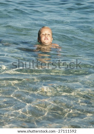 Similar – One happy little boy playing on the beach