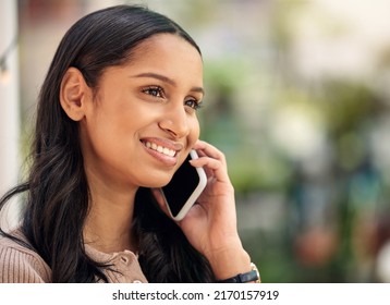 She Wasnt Born To Follow. Shot Of A Young Florist Using Her Smartphone To Make A Call.