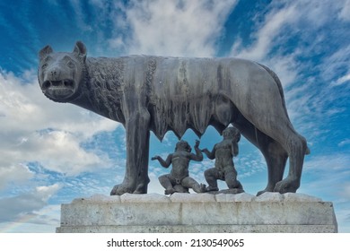 She Wolf Statue On Blue Sky Background Roman Empire Symbol Breast Feeding Newborn Romolus And Remus Silhouette 