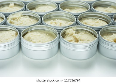 shea butter natural moisturizer in opened cream pots