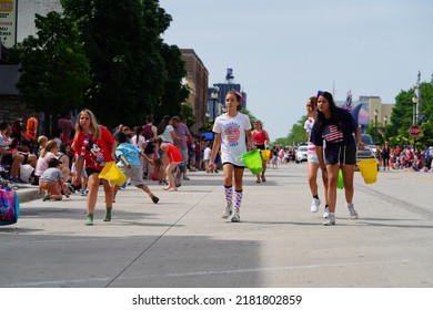 Sheboygan, Wisconsin - July 4th, 2022: Participants Of Freedom Fest Parade Handed Out Candy To Adults And Children Spectators.