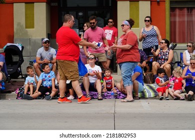 Sheboygan, Wisconsin - July 4th, 2022: Participants Of Freedom Fest Parade Handed Out Candy To Adults And Children Spectators.