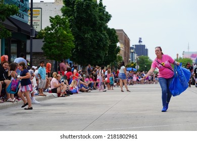 Sheboygan, Wisconsin - July 4th, 2022: Participants Of Freedom Fest Parade Handed Out Candy To Adults And Children Spectators.