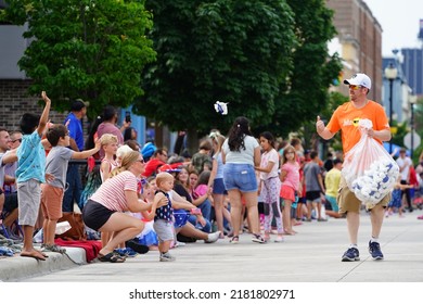 Sheboygan, Wisconsin - July 4th, 2022: Participants Of Freedom Fest Parade Handed Out Candy To Adults And Children Spectators.