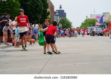 Sheboygan, Wisconsin - July 4th, 2022: Participants Of Freedom Fest Parade Handed Out Candy To Adults And Children Spectators.