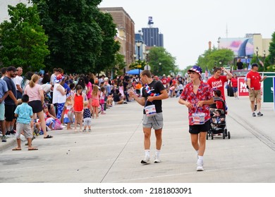 Sheboygan, Wisconsin - July 4th, 2022: Participants Of Freedom Fest Parade Handed Out Candy To Adults And Children Spectators.