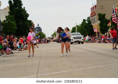 Sheboygan, Wisconsin - July 4th, 2022: Participants Of Freedom Fest Parade Handed Out Candy To Adults And Children Spectators.