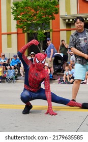 Sheboygan, Wisconsin USA - July 4th, 2022: Freedom Fest Parade Participates Dressed Up In Spider Man Costume And Interacted With Spectators.