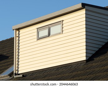 Shed Dormer With Weatherboard Cladding On Tile Roof