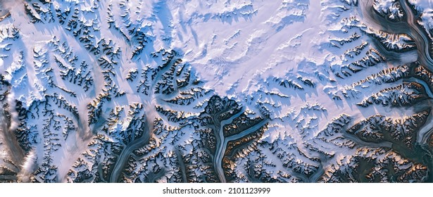 Shedding Light On Greenland, Satellite Image, Greenland Ice Sheet And Its Edges, Melt Ponds, Snowy Mountain Peaks Cast Long Shadows In The Evening Sunlight. Elements Of This Image Furnished By NASA