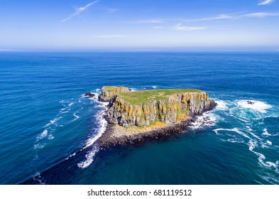 The Sheep Island Near Ballintoy, Carrick-a-Rede And Giant's Causeway, North Antrim Coast, County Antrim, Northern Ireland, UK. Aerial View. 